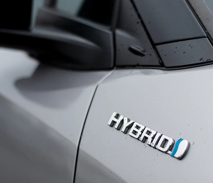 Hybrid badge on silver car